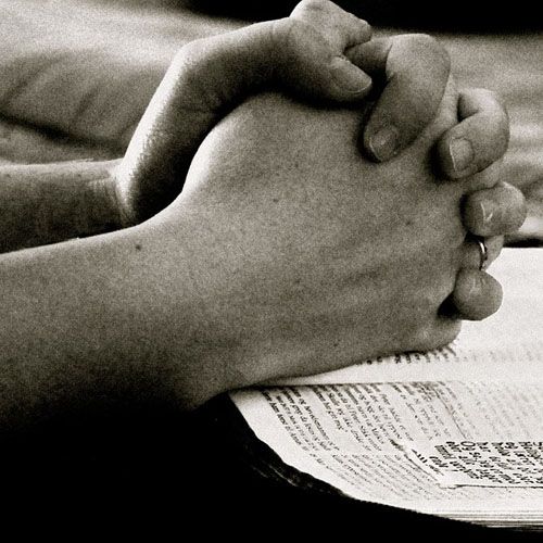 Hands folded for prayer